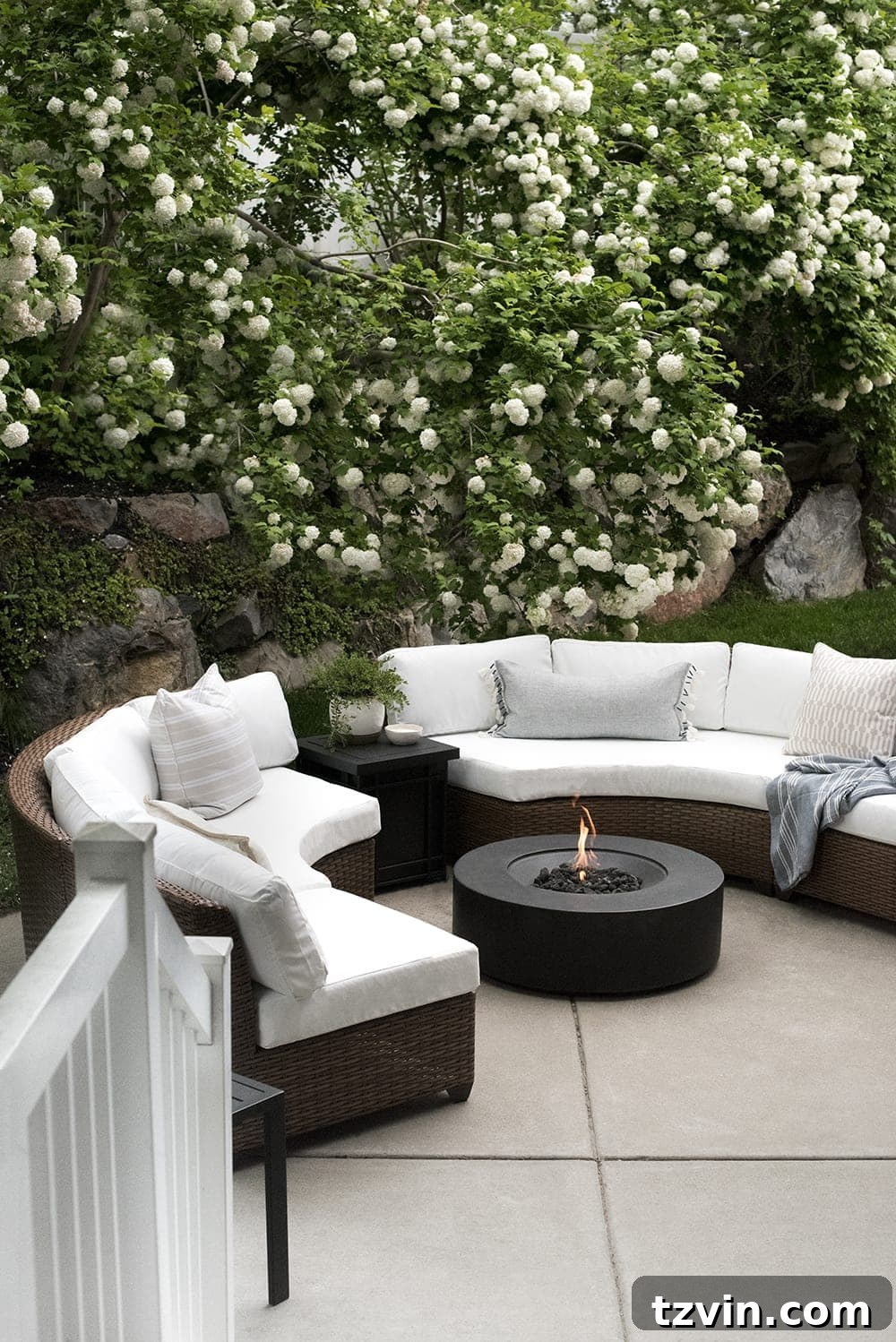 15 Mesmerizing Fire Pit Decor Transformations 10 Back patio fire pit with curved sectionals framed by beautiful flowering trees