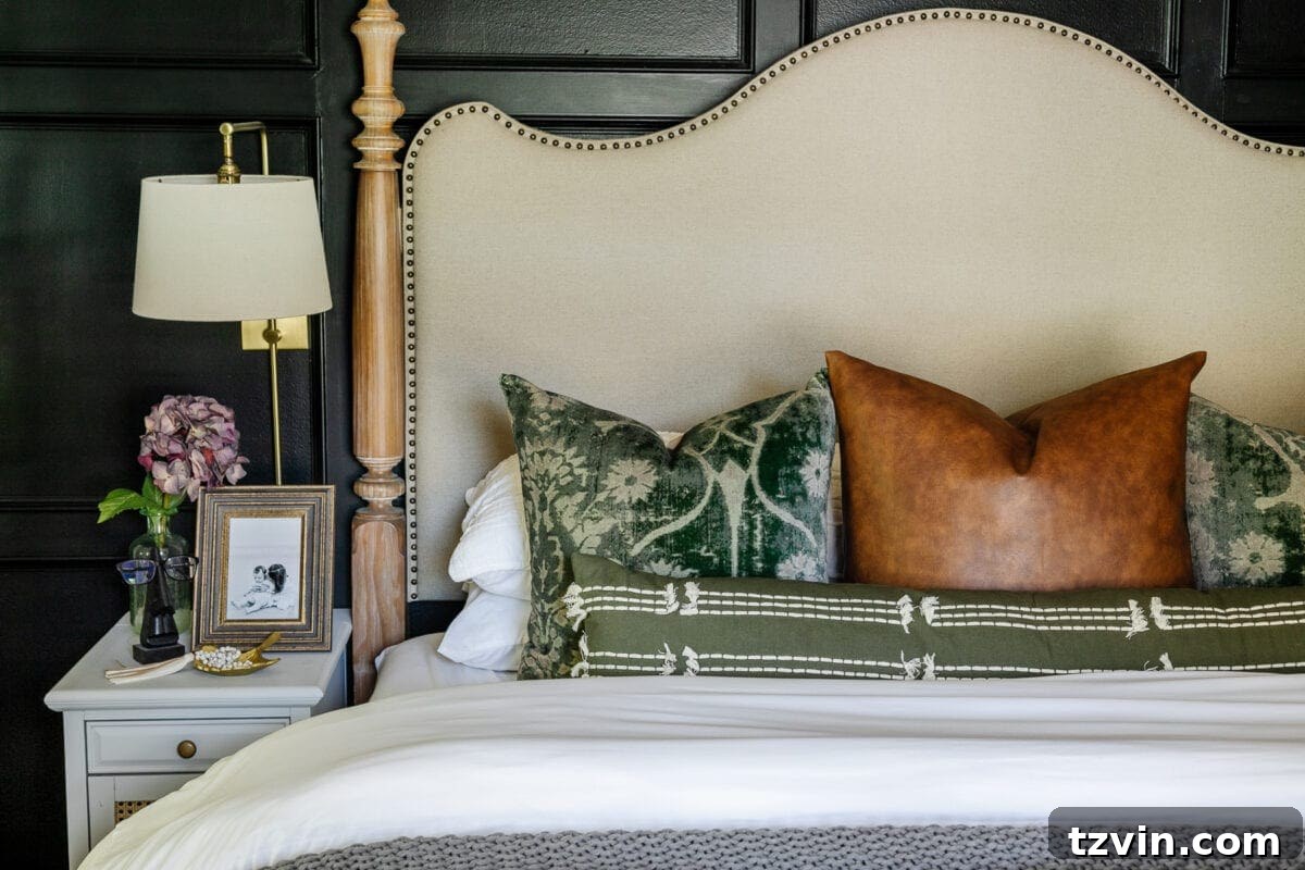 Cozy fall bedroom decor featuring a chunky knit blanket, velvet pillows, and warm tones.