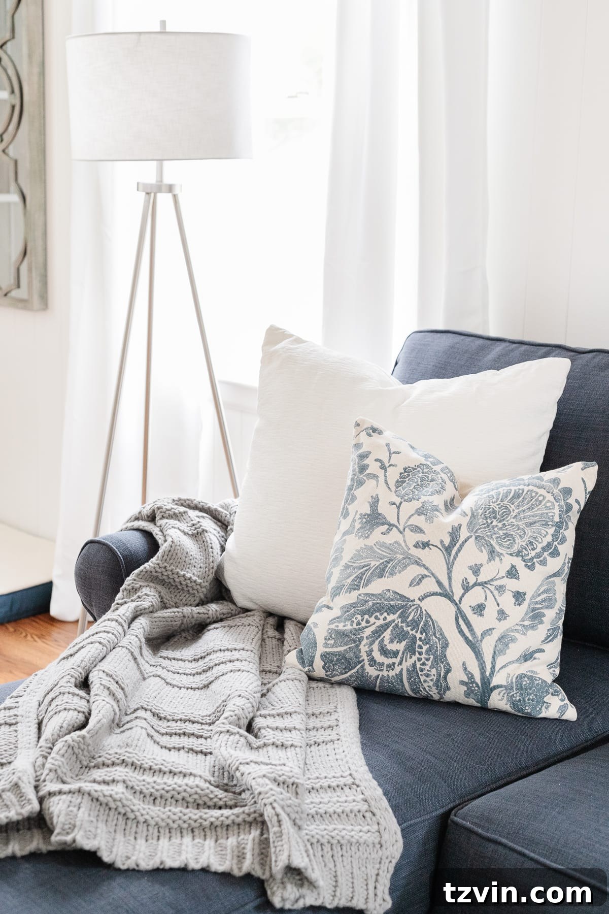 Transform Your Space: The Art of Pairing Throw Pillows 4 Stylish coastal living room sofa adorned with a carefully selected mix of throw pillows in varied patterns and textures.