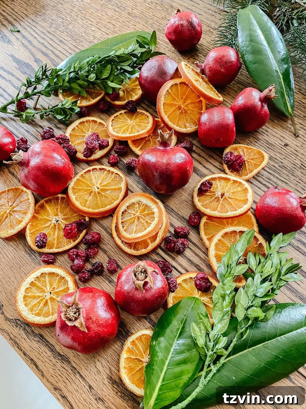 Harvesting Holiday Beauty: Drying Fruit and Preserving Leaves 2 Dried fruit and preserved leaves artfully arranged for elegant natural Christmas decor