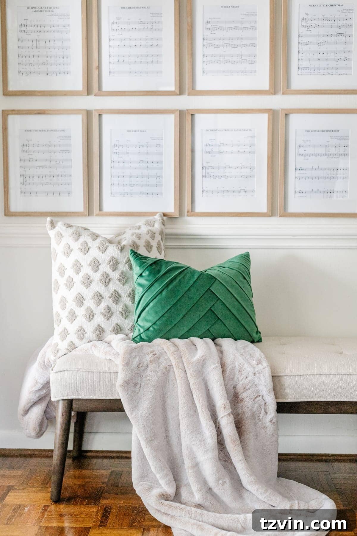 Christmas pillows on bench in entryway with sheet music art