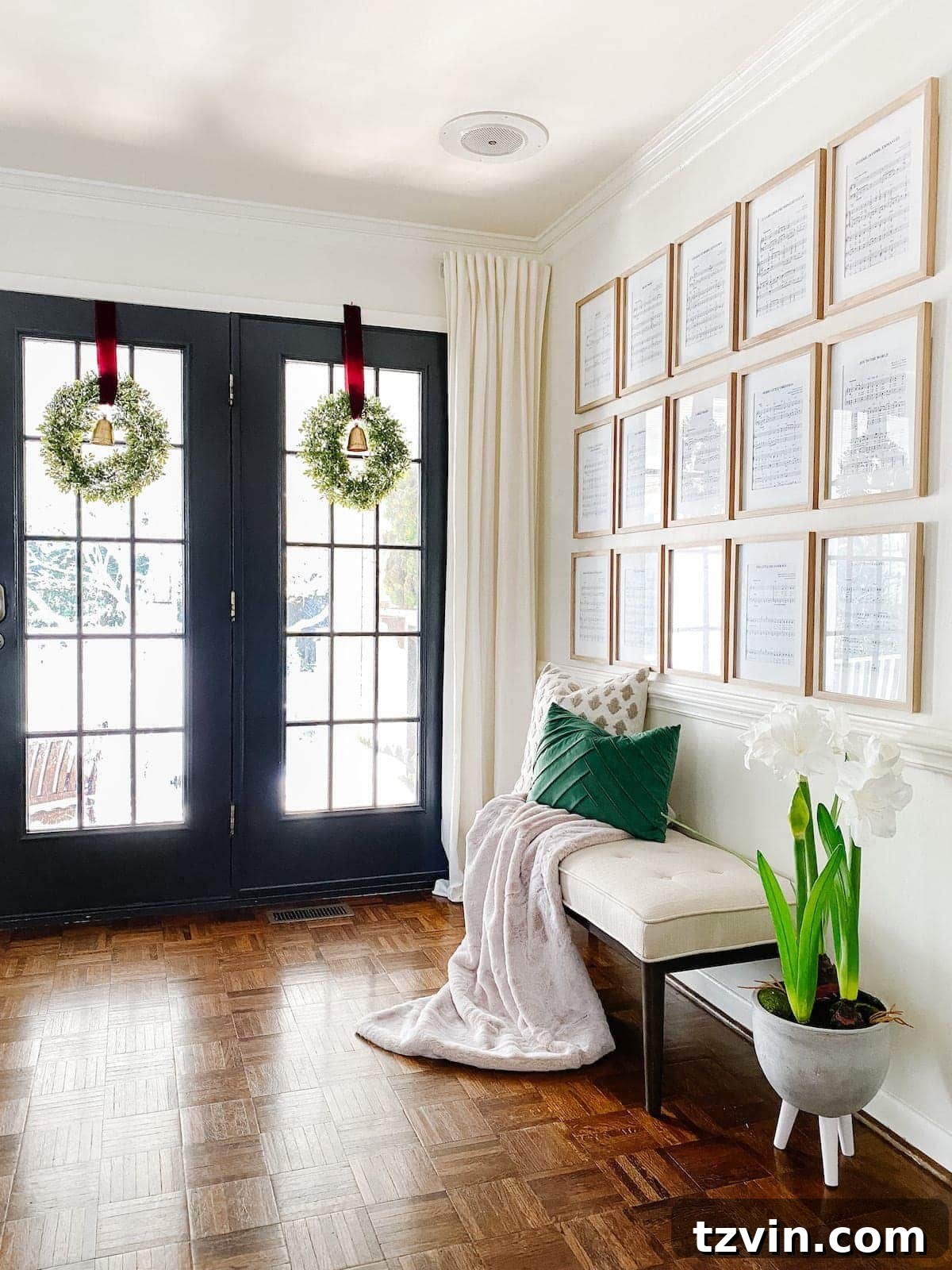 wreaths on windows and entryway with Christmas wall decor using sheet music art