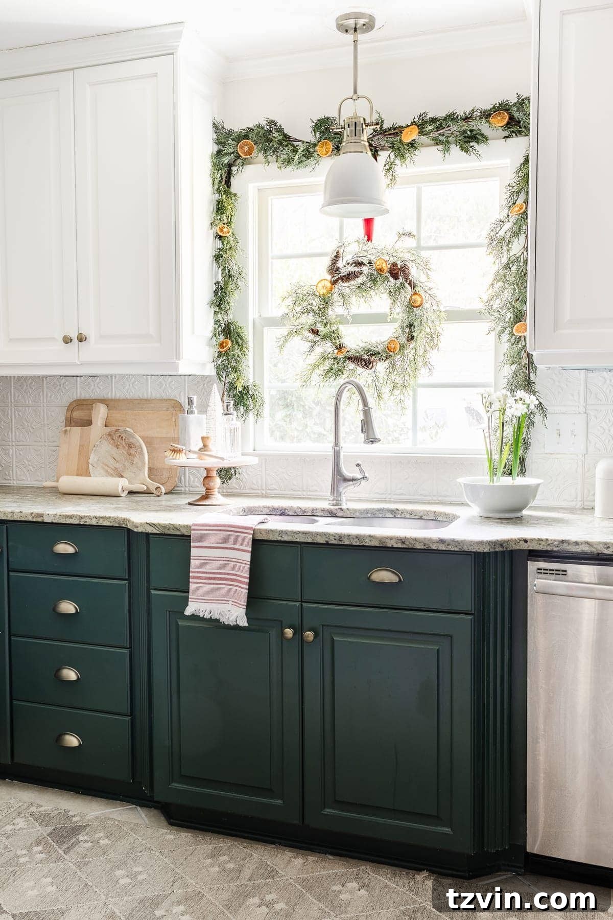 Christmas kitchen window decorated with garland and wreath