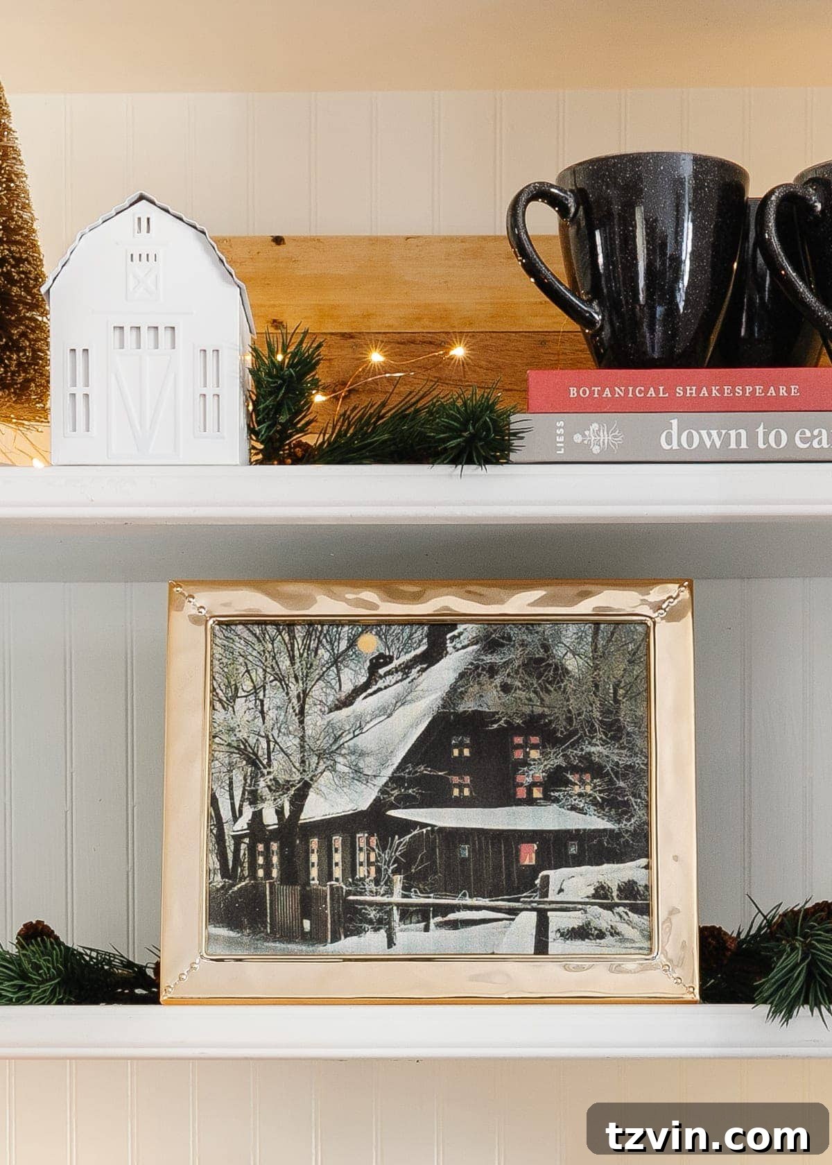 snow cabin art printable on a shelf