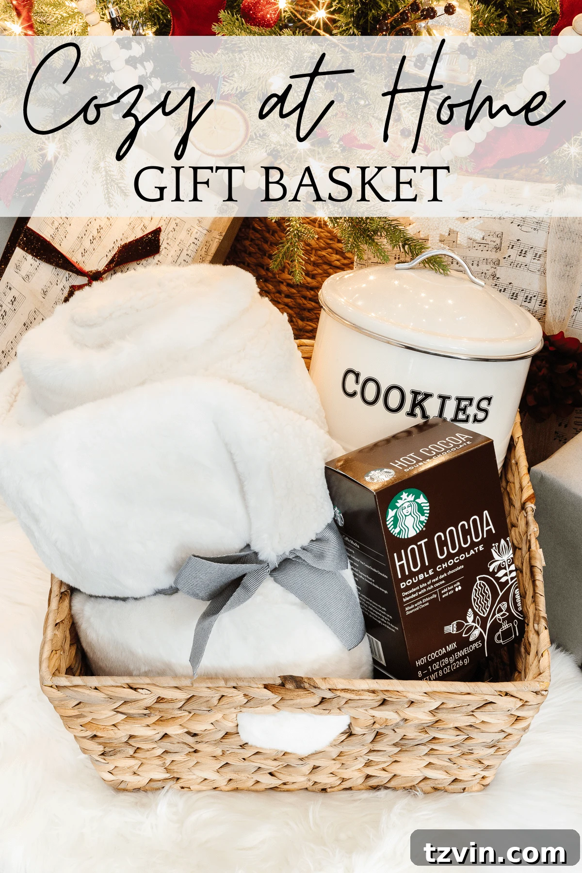 50 Festive Christmas Gift Basket Ideas 10 Cozy at Home Christmas Basket with cookies, hot cocoa, and a throw blanket