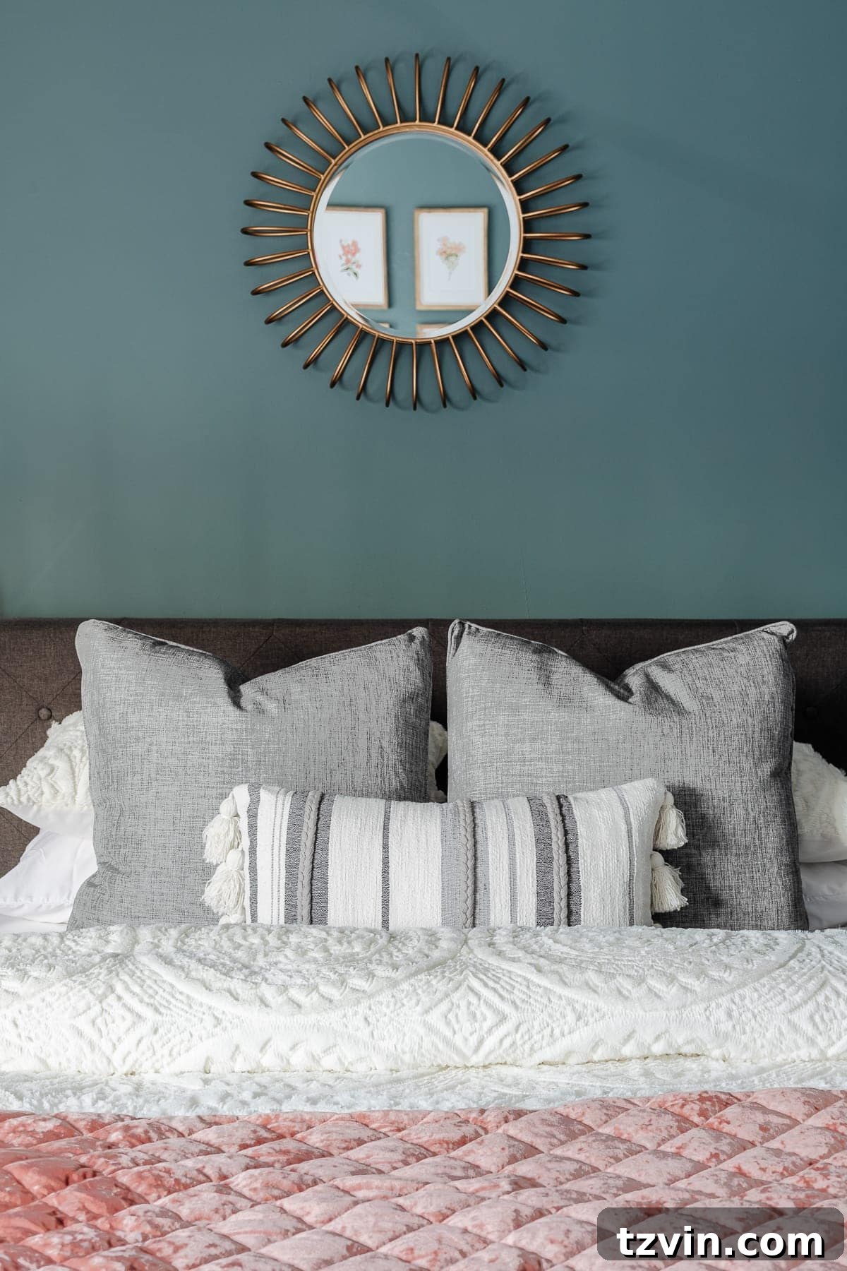 Transform Your Bedroom into a Serene Spa Sanctuary 11 Luxurious soft bedding with neutral throw pillows on a bed in a teal bedroom