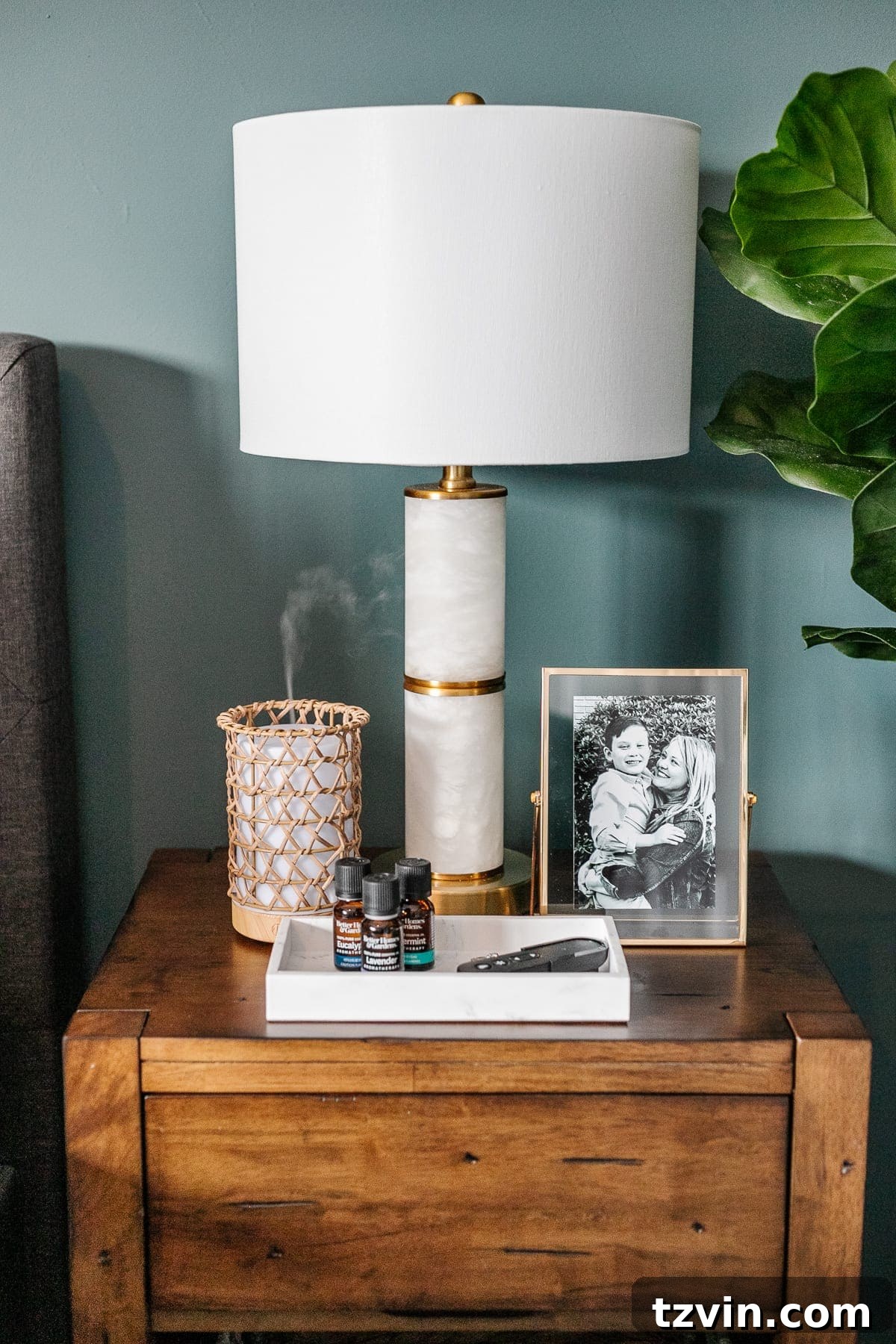 Transform Your Bedroom into a Serene Spa Sanctuary 14 Marble and gold lamp on a nightstand, providing cozy lighting