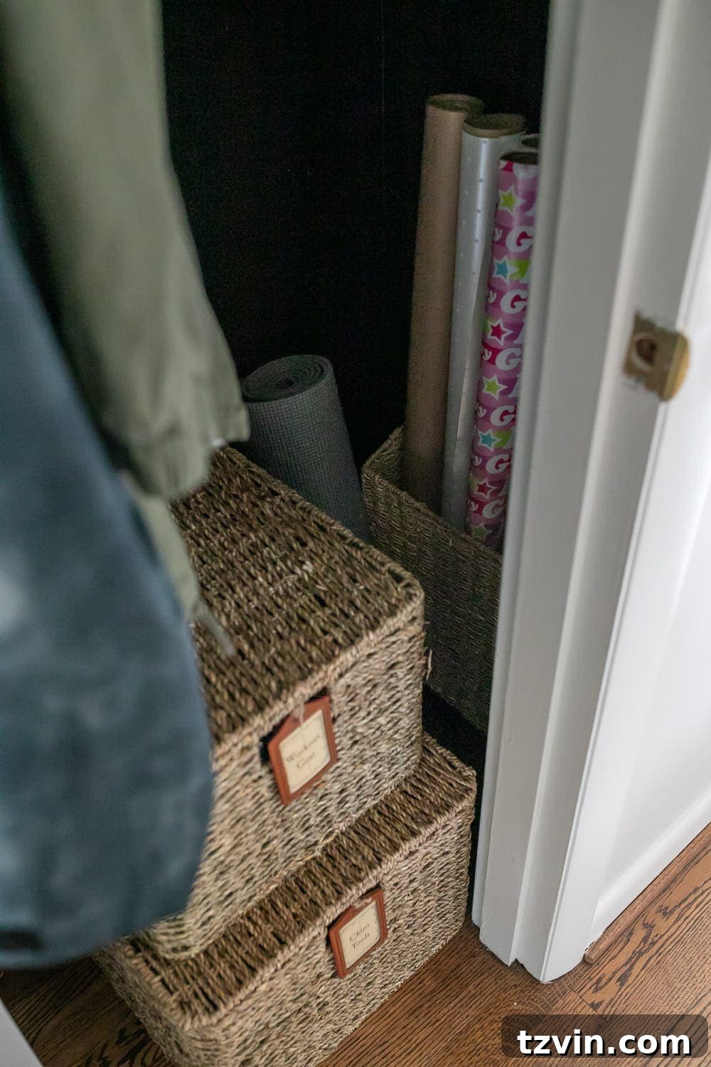 Baskets for organizing workout gear and gift wrap supplies in a coat closet