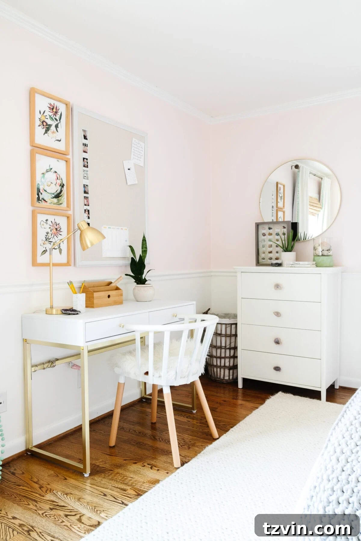 Dresser with new knobs and a round gold mirror in a girl's room