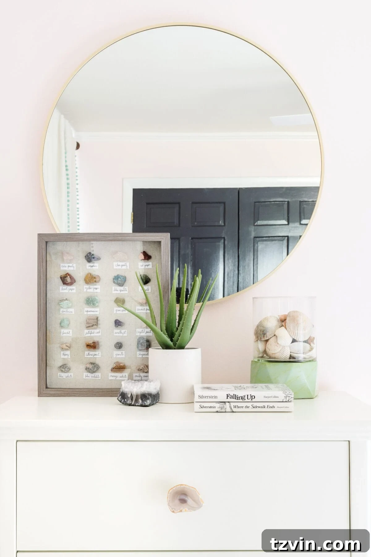 Seashells in a hurricane lantern and DIY geology art in a girl's room