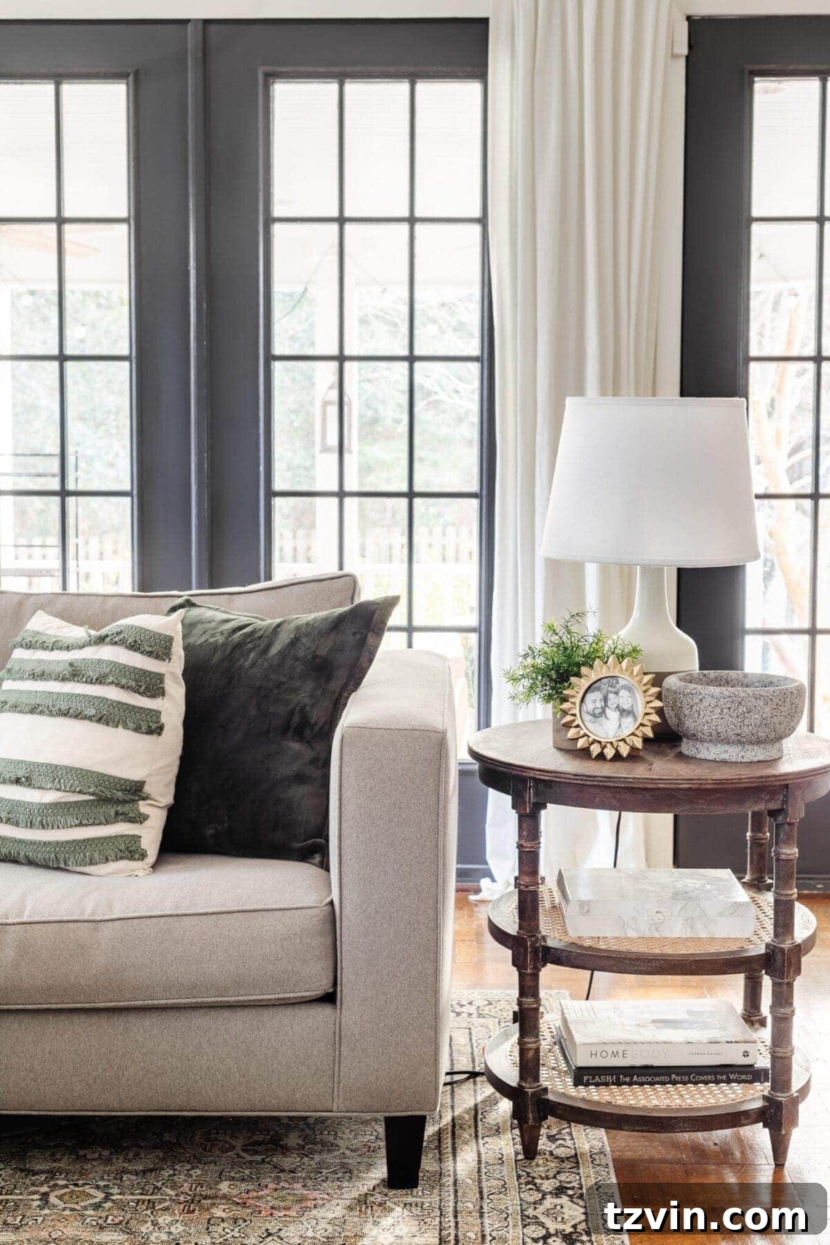 My Favorite Winter Living Room Touches 9 A stylish living room featuring warm, heavy textiles like blankets and pillows, creating a cozy winter atmosphere.