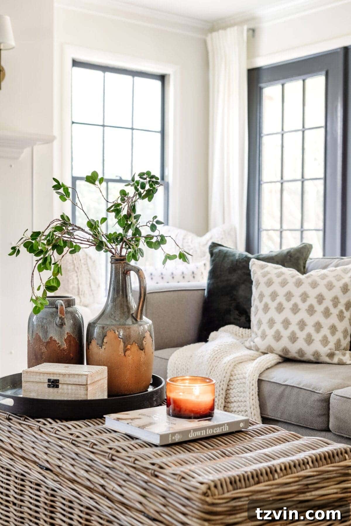 My Favorite Winter Living Room Touches 5 Close-up of elegantly arranged candles and a decorative element, contributing to a cozy and warm winter decor scheme.