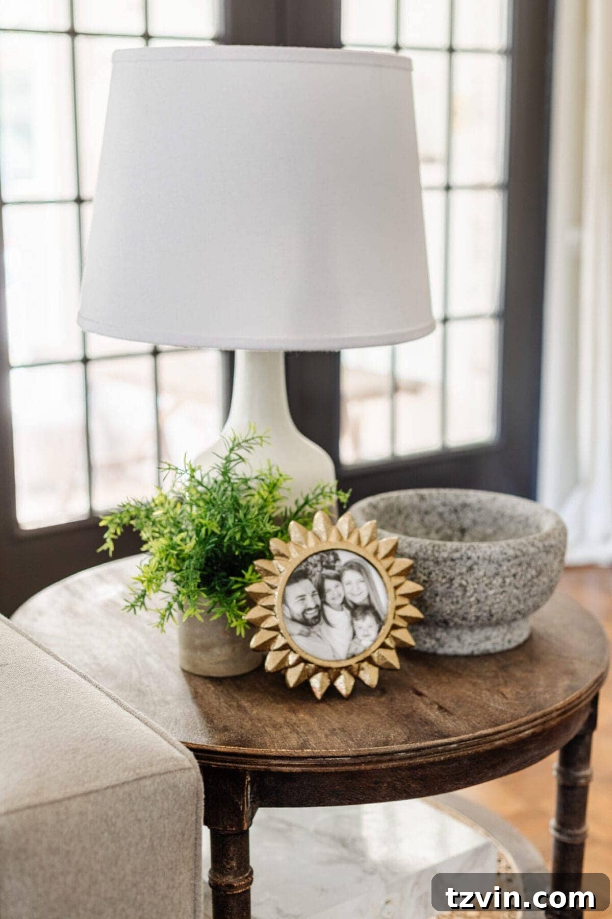 My Favorite Winter Living Room Touches 8 Another perspective of an end table with elegant winter decor, highlighting a small potted plant and textured elements.