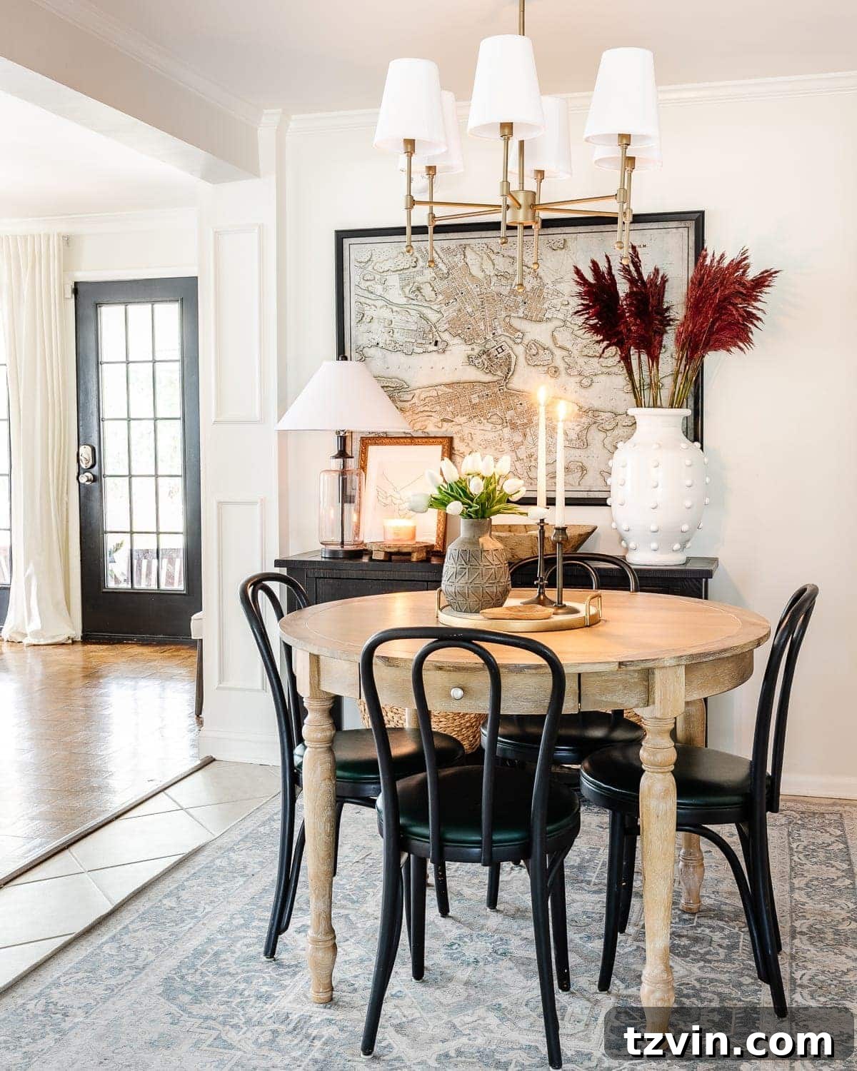 Curated Valentine's Day Elegance 2 Elegant Valentine's Day dining table setup with white tulips and brass candleholders.