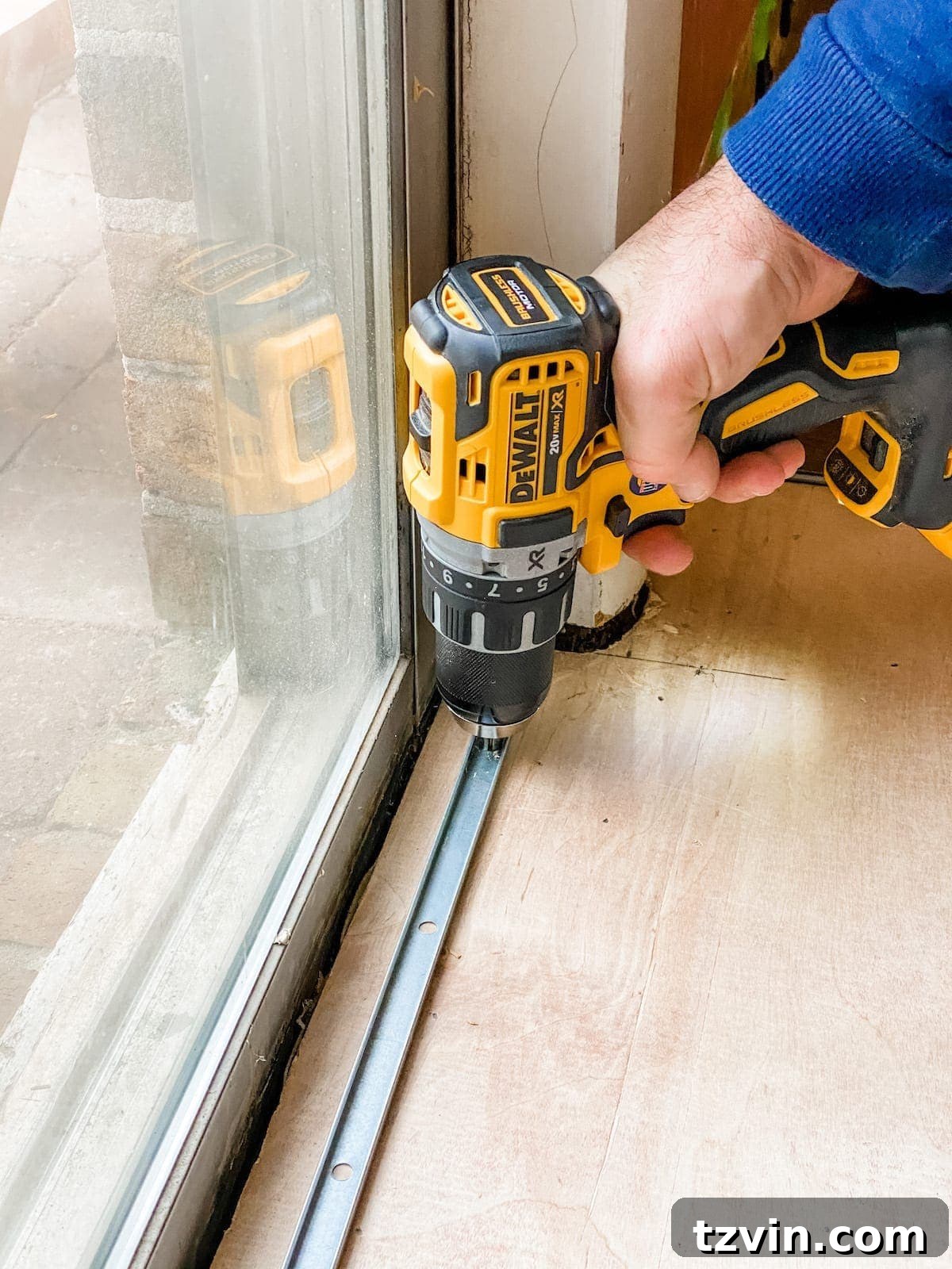 Mastering Luxury Vinyl Plank Installation 11 setting a threshold for luxury vinyl plank flooring installation at a doorway