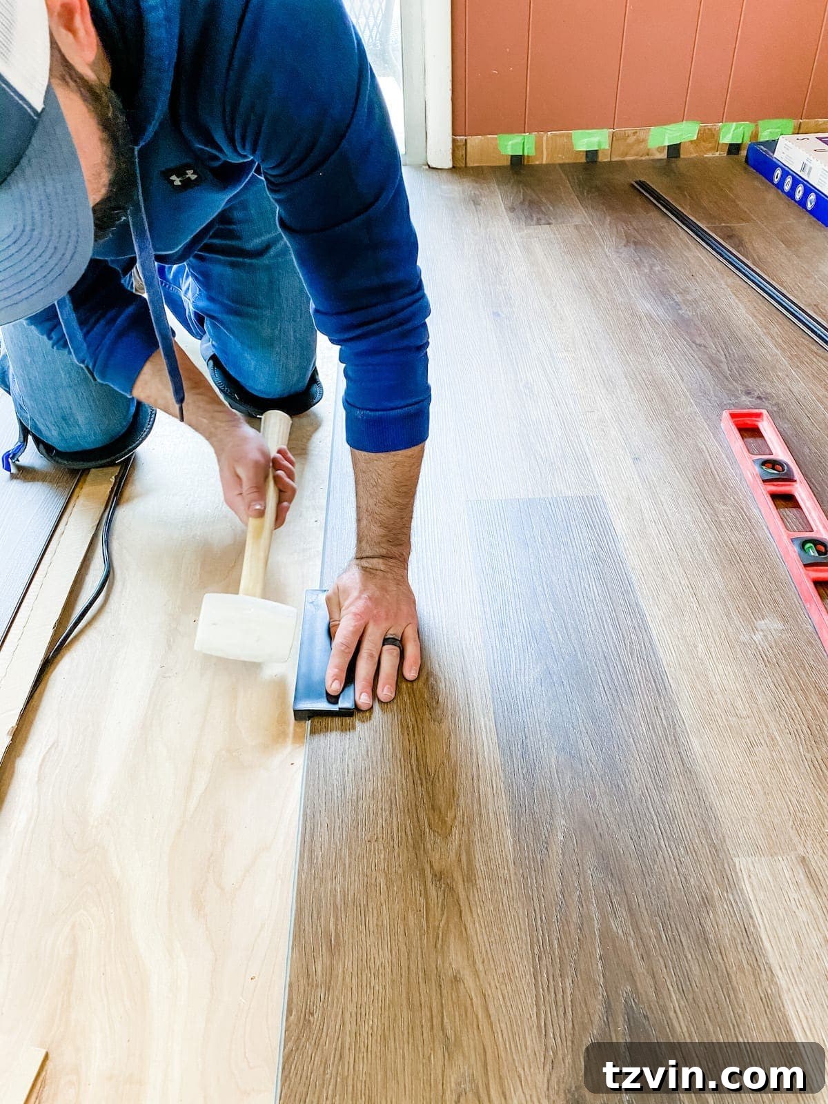 Mastering Luxury Vinyl Plank Installation 21 how to install luxury vinyl plank flooring using a tapping block and rubber mallet