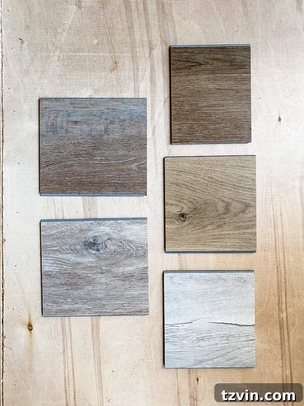 Mastering Luxury Vinyl Plank Installation 4 ProCore Flooring samples displayed for color comparison in a room