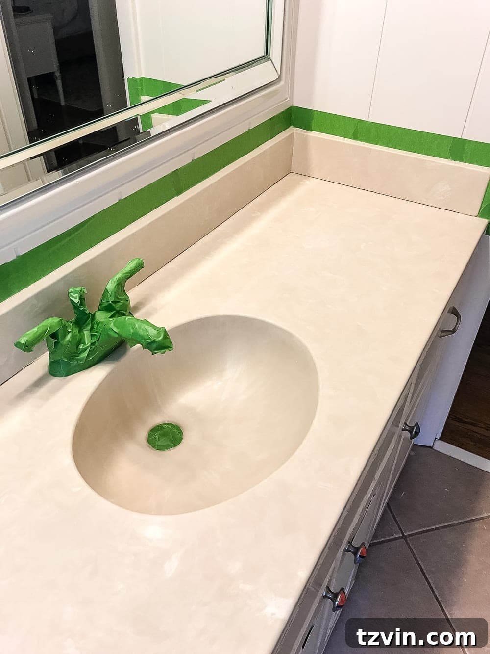 Beige countertop before painting, showing original dated color.