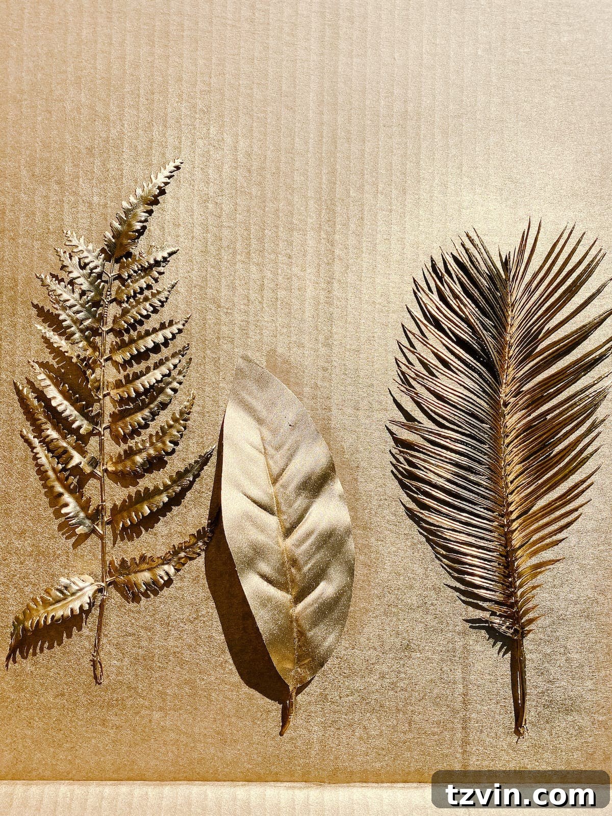 Luxe for Less: DIY Gilded Designer Sculpture 4 gold spray painted leaves