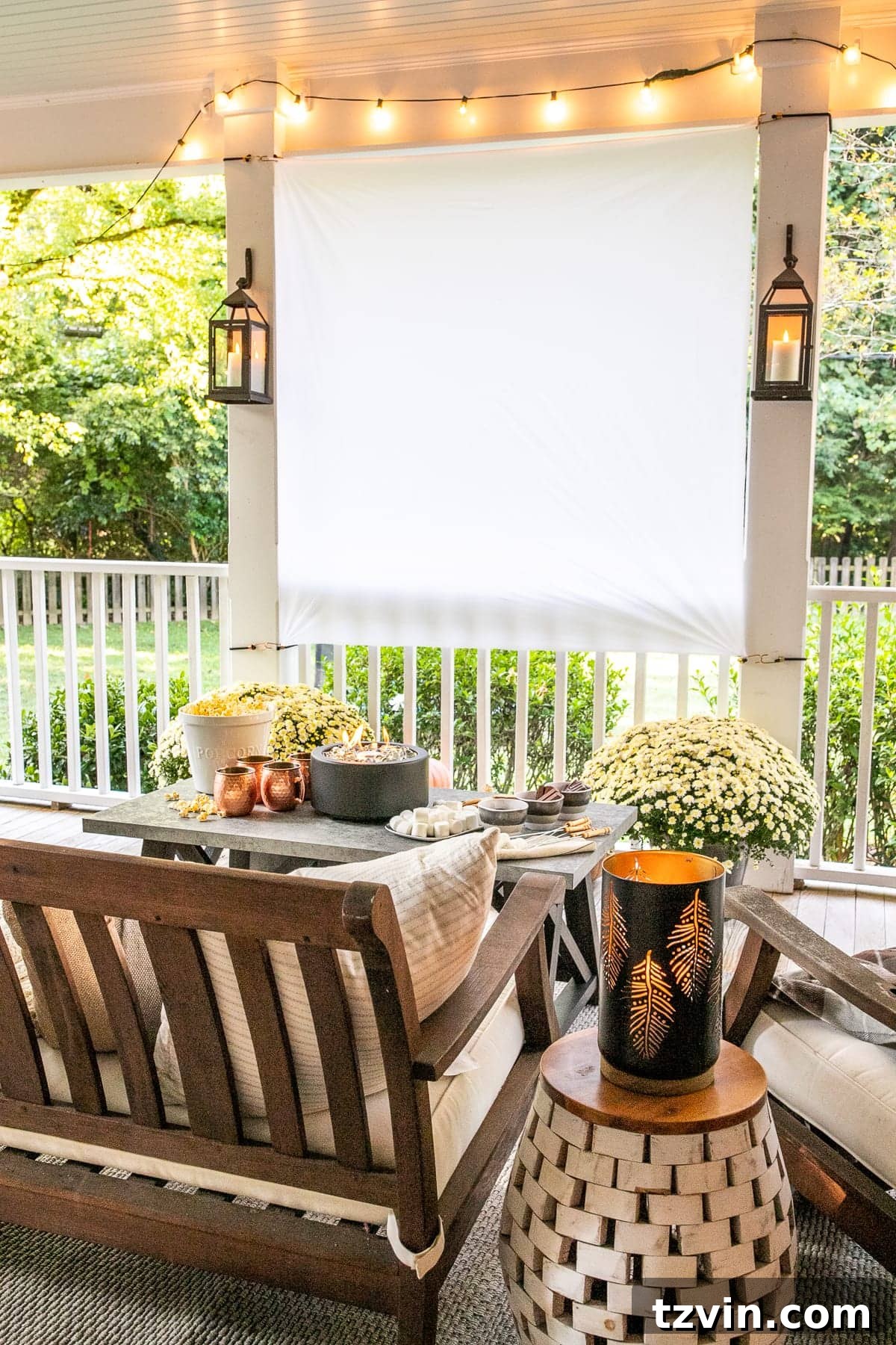 10 Spring Outdoor DIY Transformations 5 Cozy outdoor movie night setup with DIY screen and s'mores table