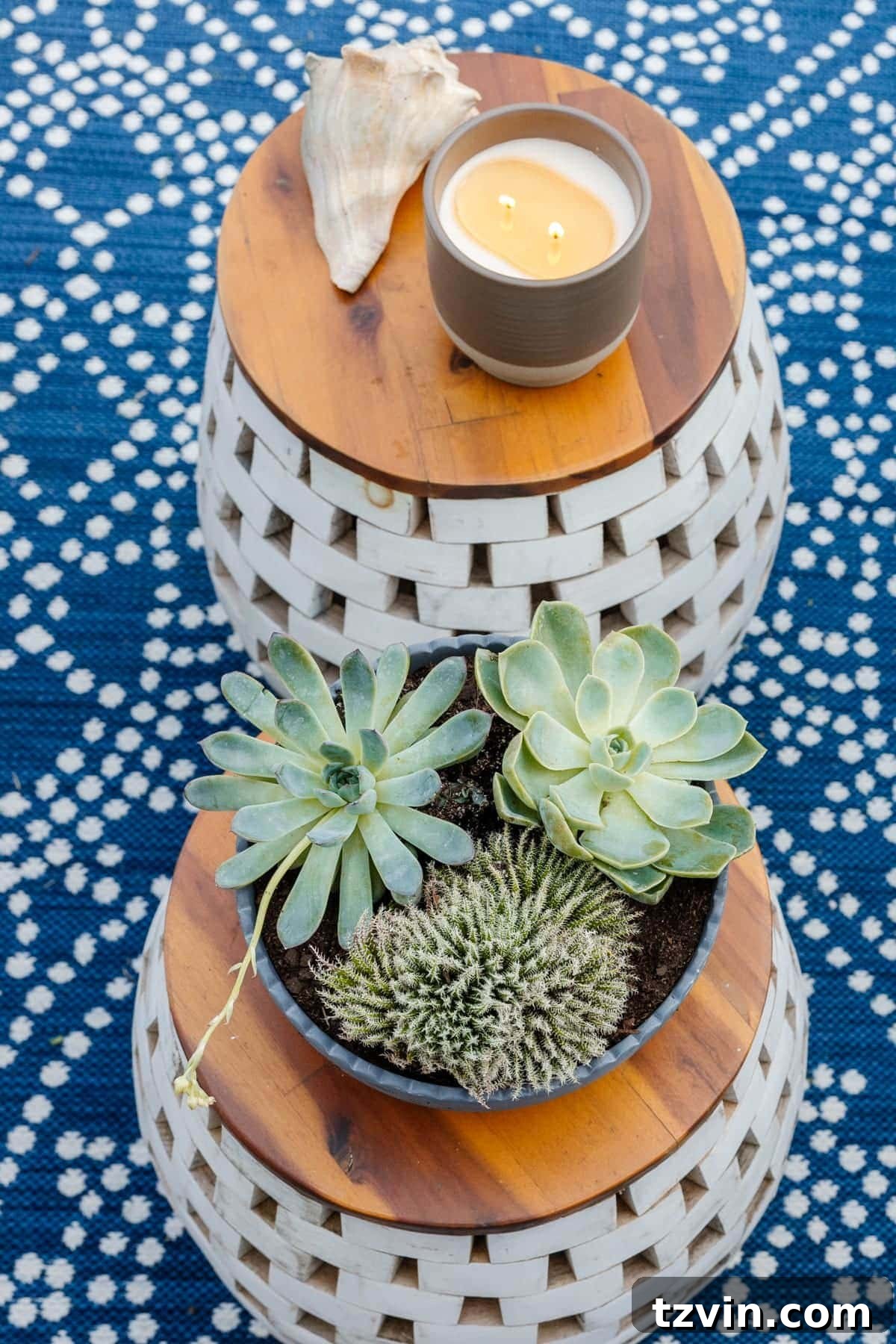 garden stools used as tables with plants and candles on top