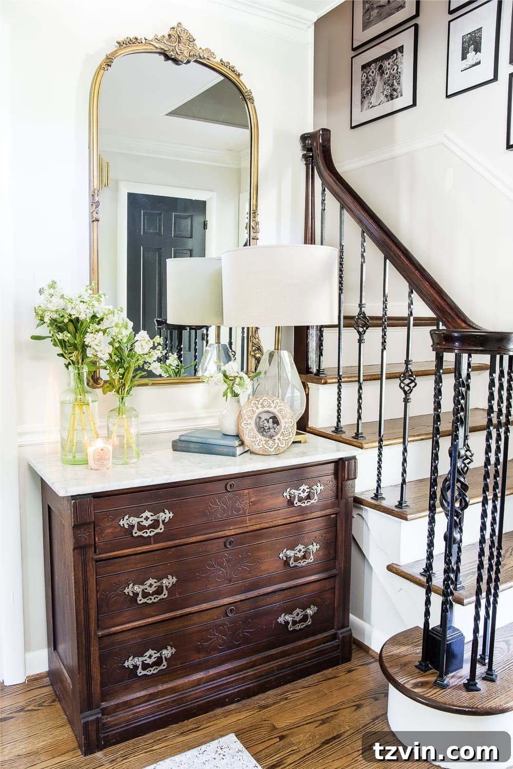 Antique gold mirror in entryway with classic decor