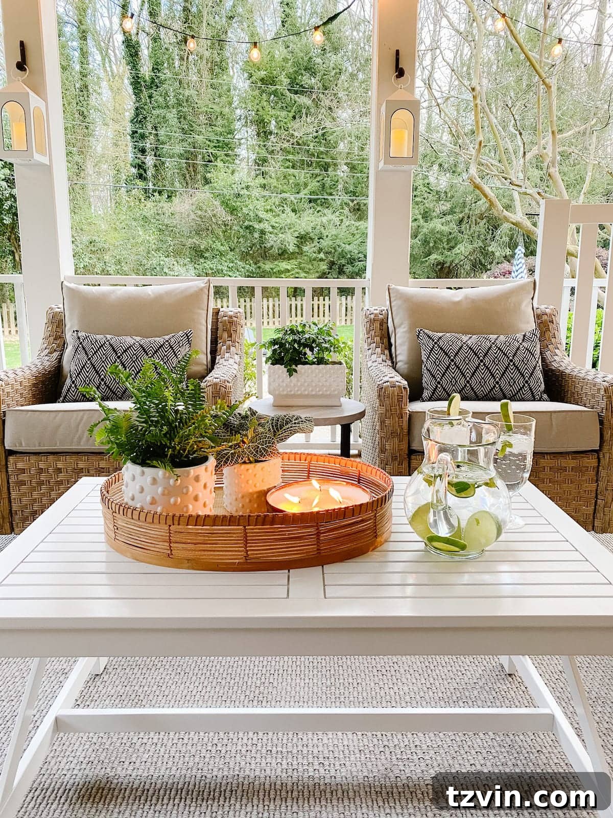 Back Porch Bliss Makeover 12 White battery-operated lanterns and twinkling string lights create a magical and inviting evening ambiance on the back porch.
