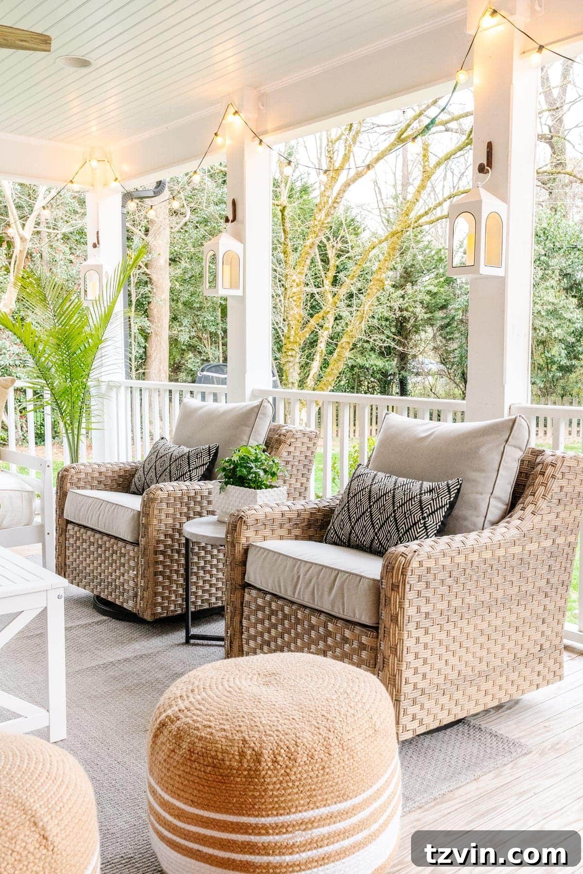 Back Porch Bliss Makeover 3 Close-up of comfortable outdoor swivel chairs with soft, neutral-toned cushions on a refreshed back porch, inviting relaxation.