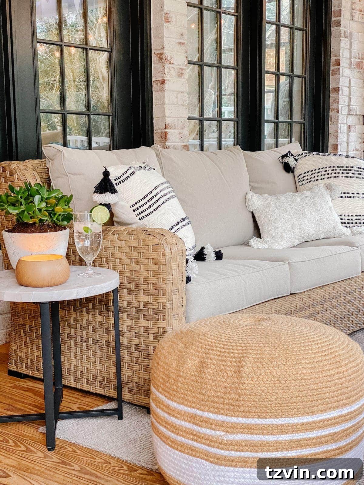Back Porch Bliss Makeover 5 A comfortable outdoor sofa with its protective cover in place, ensuring the furniture stays clean and protected from the elements.
