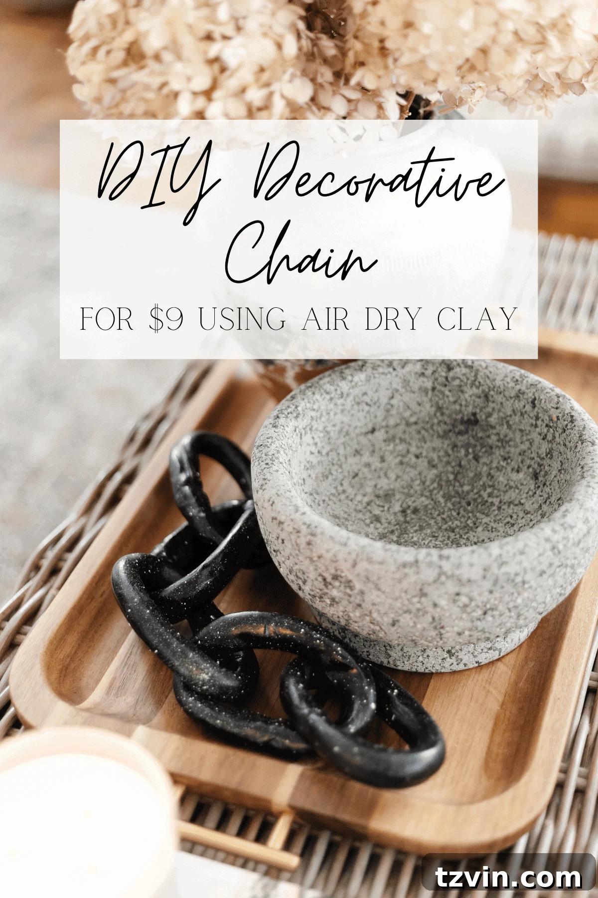 Create Decorative Chains from Air Dry Clay 2 A beautifully styled coffee table featuring a handmade decorative chain made from air dry clay, alongside dried hydrangeas and books, creating a modern and elegant centerpiece.