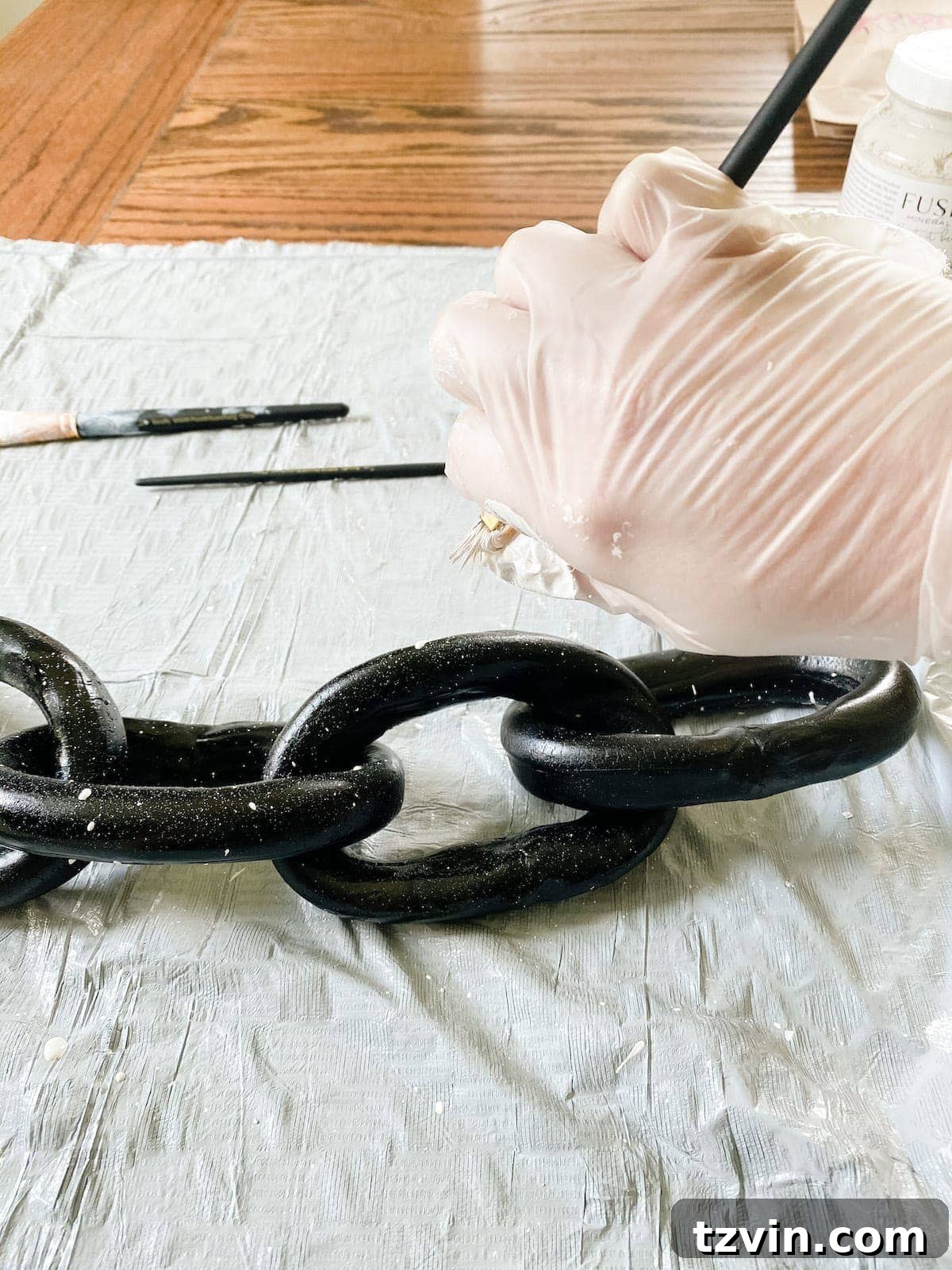 Create Decorative Chains from Air Dry Clay 7 A fully formed air dry clay chain, painted solid black, ready for the faux stone finishing touches.