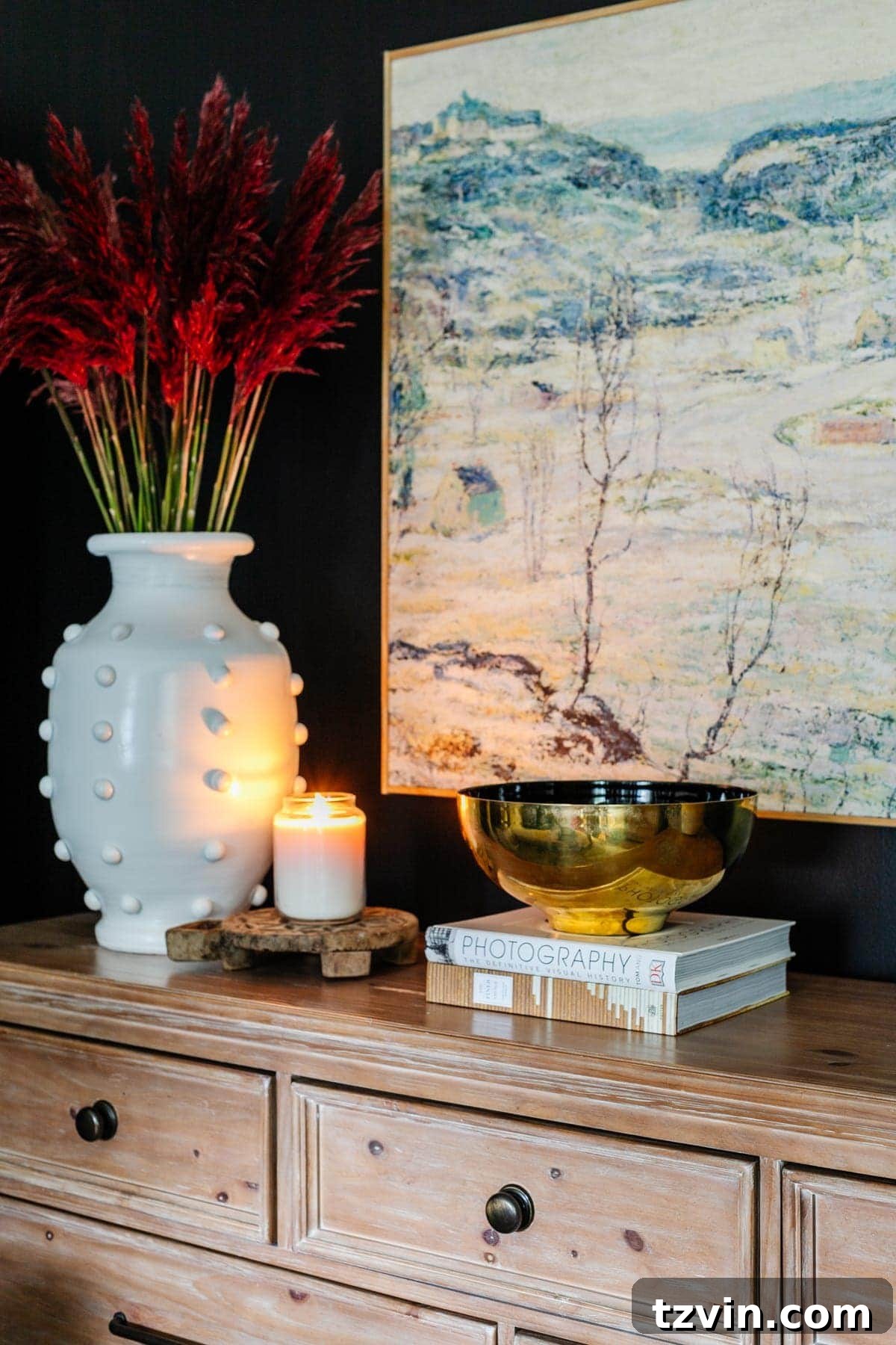 Curated Coffee Table Collections for Every Passion 4 Coffee table books decoratively arranged on a bedroom dresser, showcasing how they can enhance personal spaces beyond the living room