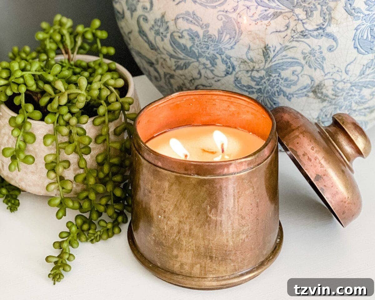 A newly crafted DIY candle in an antique brass canister, with its wick perfectly trimmed, ready for use.