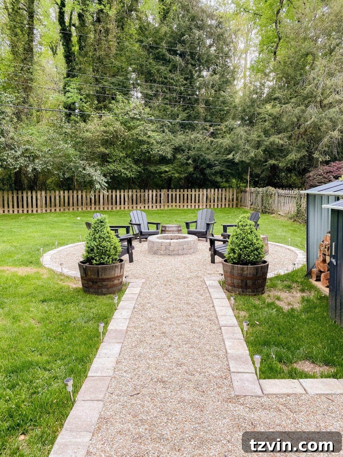 Transformed backyard showcasing newly graded landscape and vibrant shrubbery.