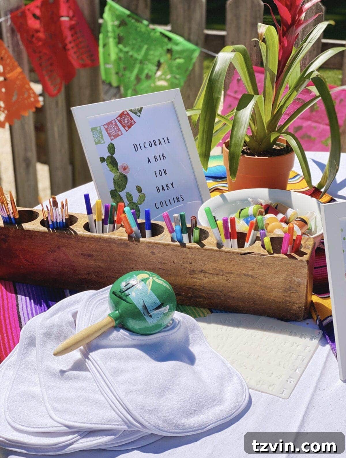 Make Your Baby Shower a Fiesta to Remember 11 Mexican themed bib decorating station for baby shower