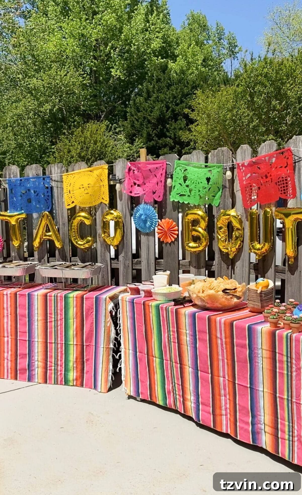 Make Your Baby Shower a Fiesta to Remember 13 Baby shower taco bar decorated with Mexican serape tablecloths, banners, and Taco Bout a Baby balloons