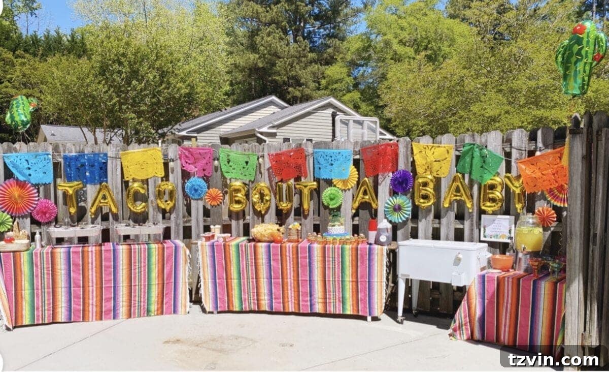 Make Your Baby Shower a Fiesta to Remember 8 Baby shower taco bar decorated with Mexican serape tablecloths and balloons