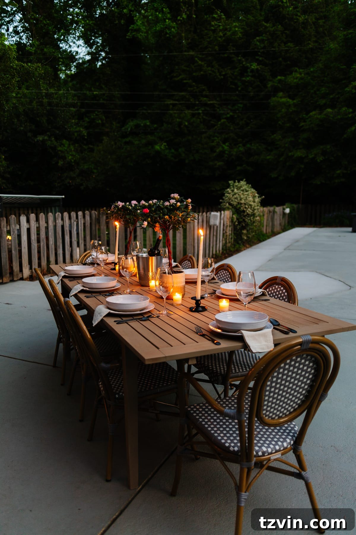 Craft Your Own Driftwood Style Outdoor Dining Table 15 Night time backyard patio and back porch with string lights and candlelight