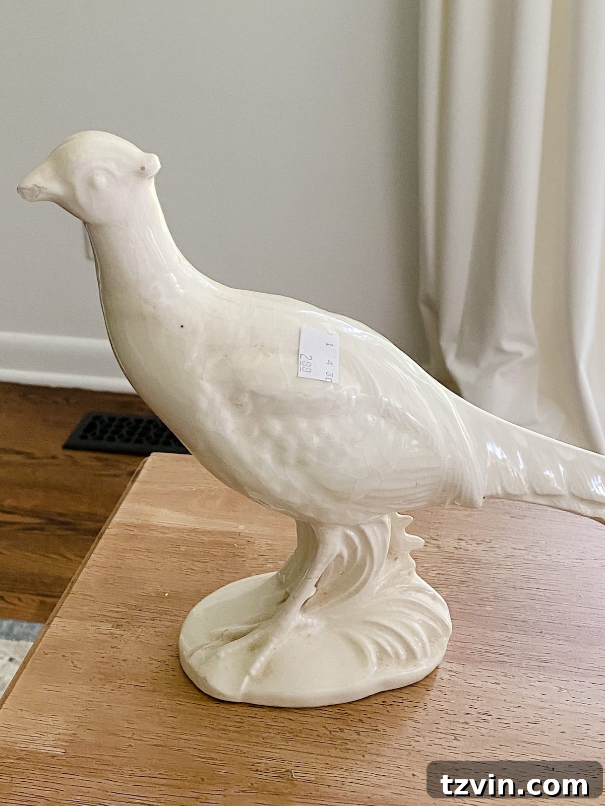 thrifted pheasant figurine before DIY texture paint makeover to show original state
