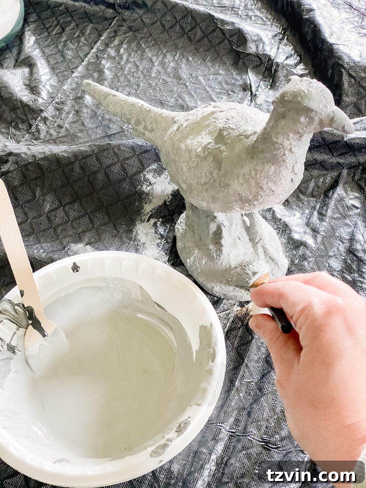 applying diy texture paint using dabbing technique for layered stone effect