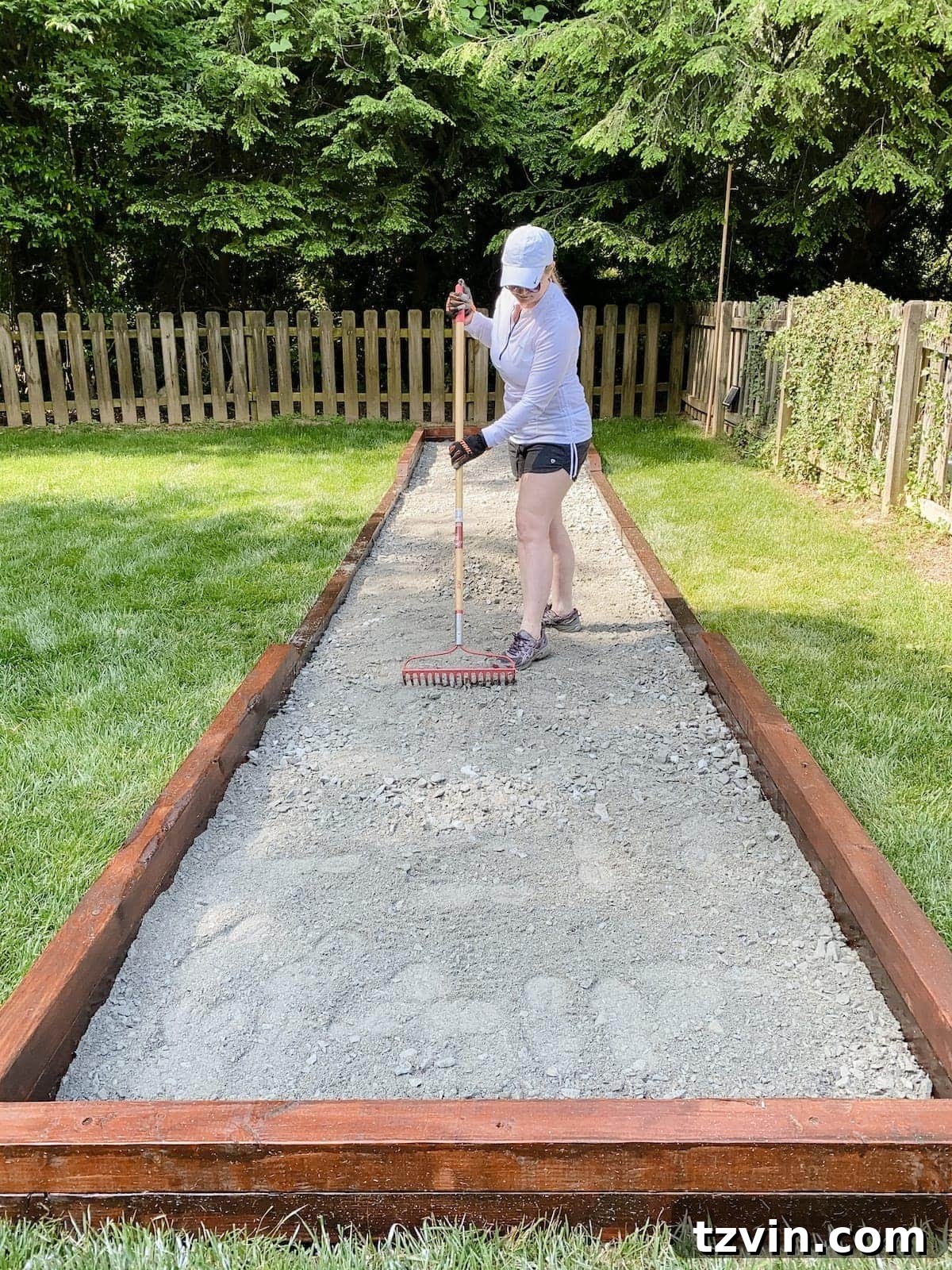 spreading paver base for bocce ball court
