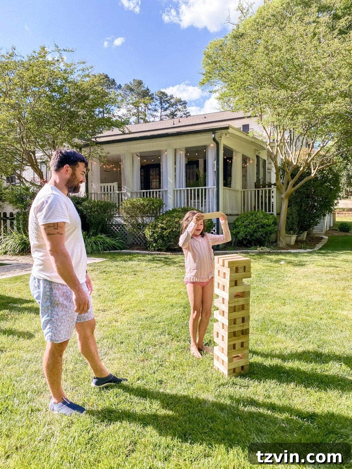 Epic Yard Games for Your Backyard Barbecue Bash 6 father and daughter playing backyard Giant Jenga yard game