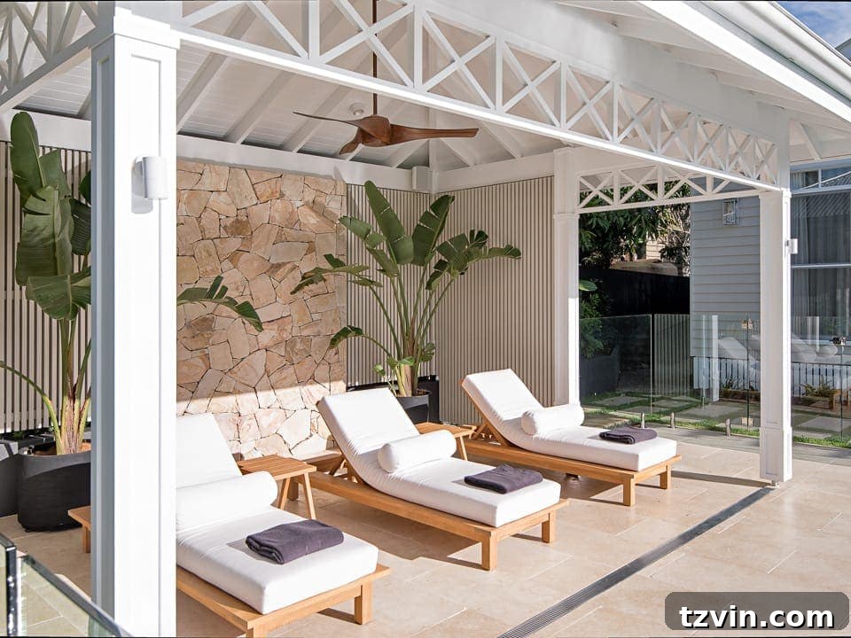 7 Pool Cabana Visions Sparking Our Next Backyard Transformation 3 white cabana with outdoor lounge chairs and stone wall