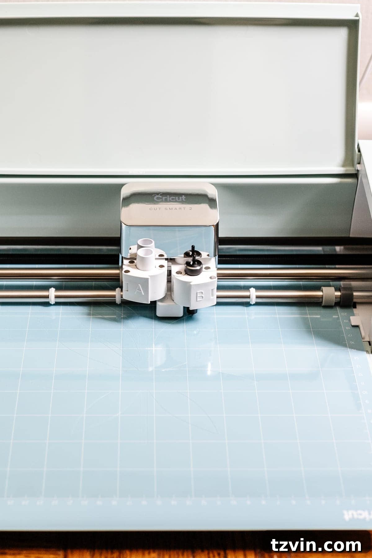 Cricut machine cutting the floral stencil from acetate