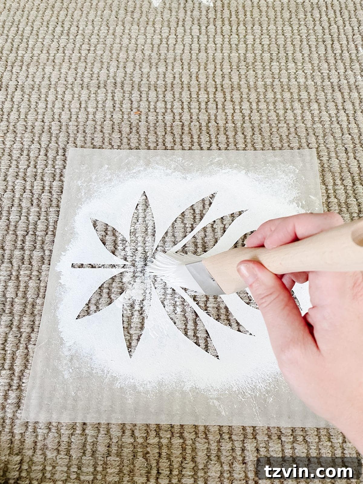Stenciling a floral block pattern onto the outdoor rug