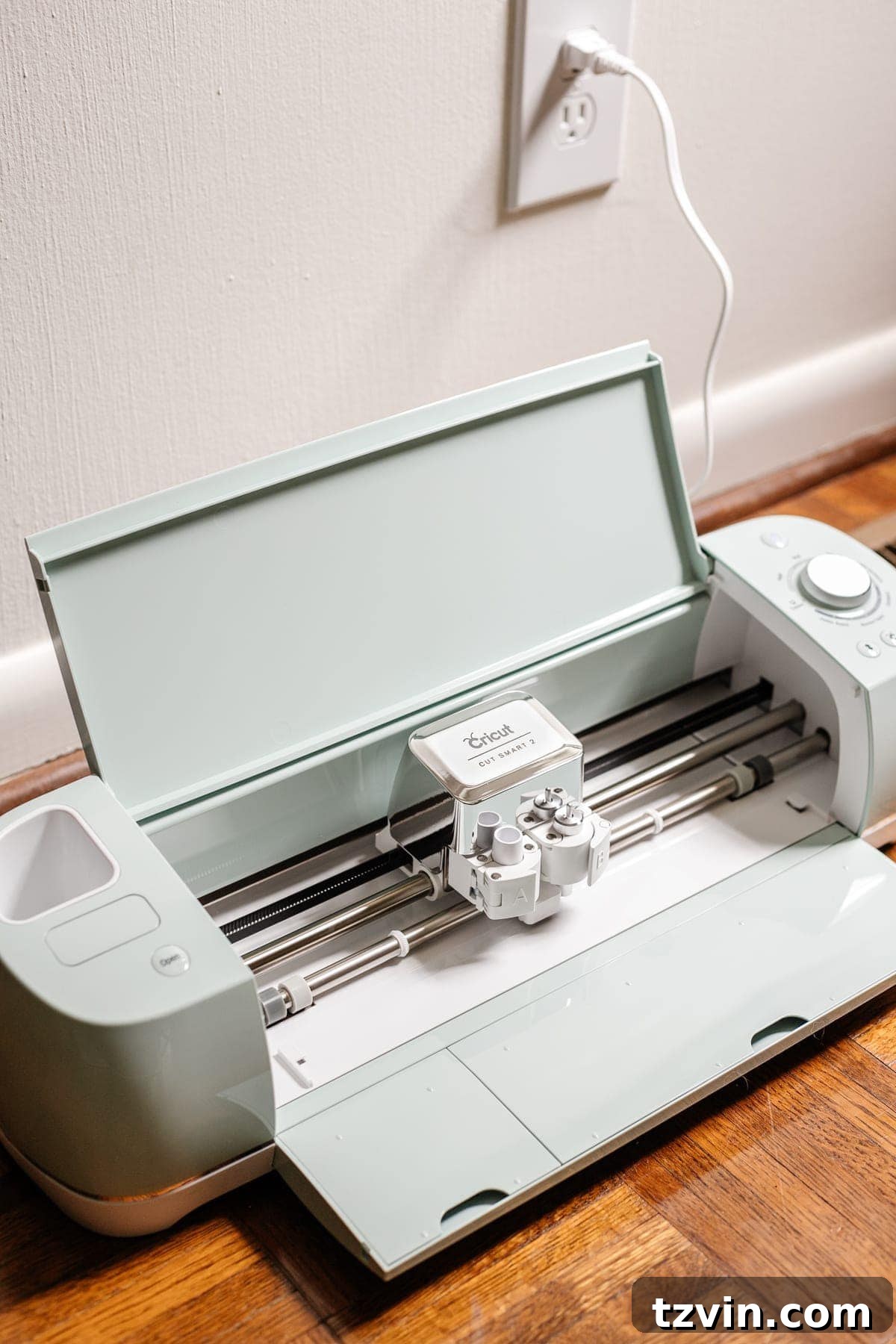 Cricut machine set up to make a custom stencil for a floral block rug
