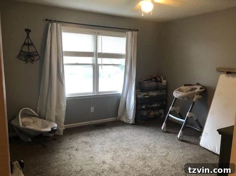 Our Cozy Woodland Wonderland: Baby Boy Nursery Transformation 2 Nursery before makeover, showing a simple room with board and batten walls