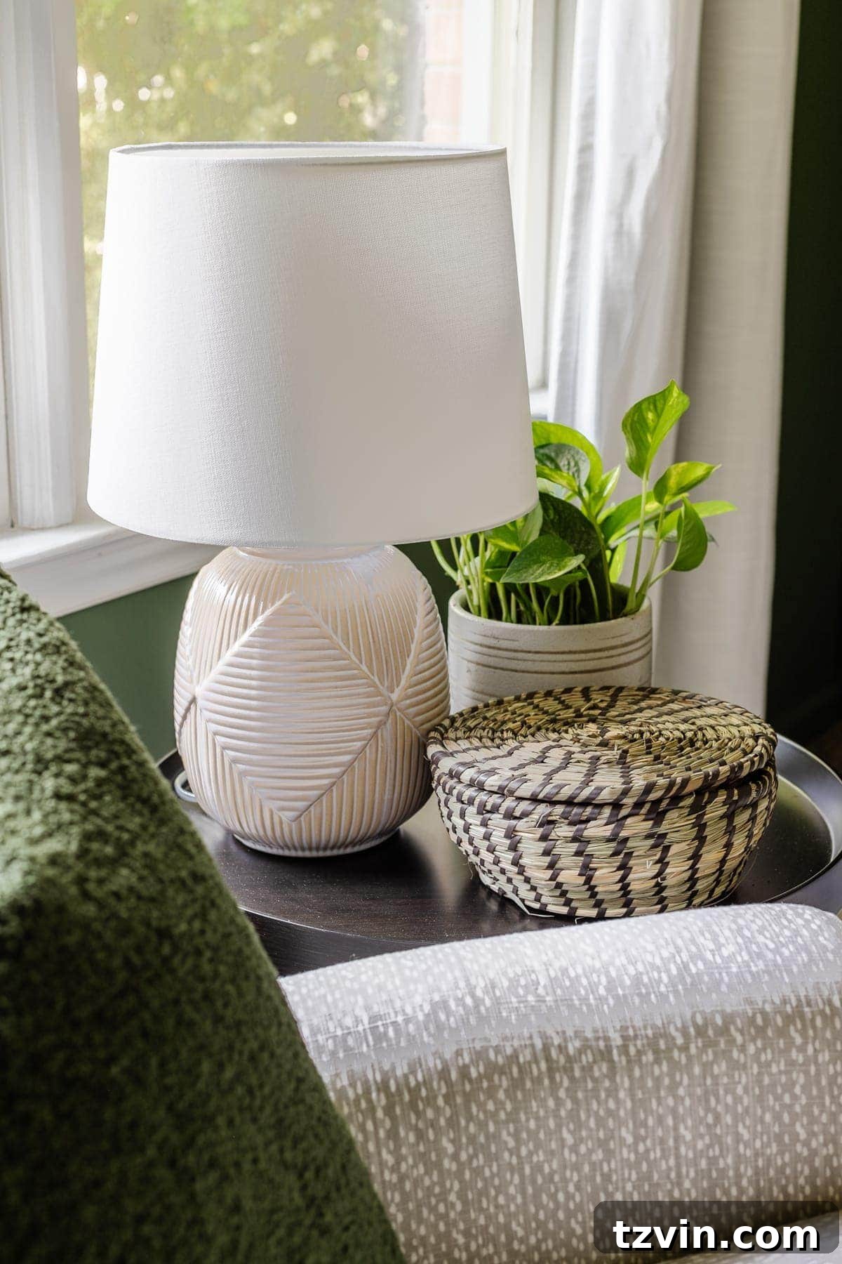 Our Cozy Woodland Wonderland: Baby Boy Nursery Transformation 12 Nursery side table with reactive glaze lamp, plant, and lidded basket for baby essentials