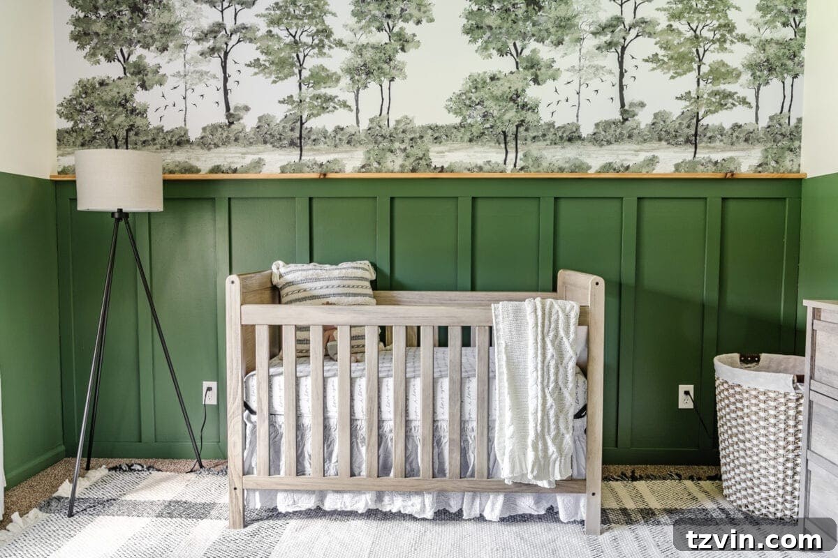 Our Cozy Woodland Wonderland: Baby Boy Nursery Transformation 4 Woodland themed nursery with deep green walls and forest mural behind the crib