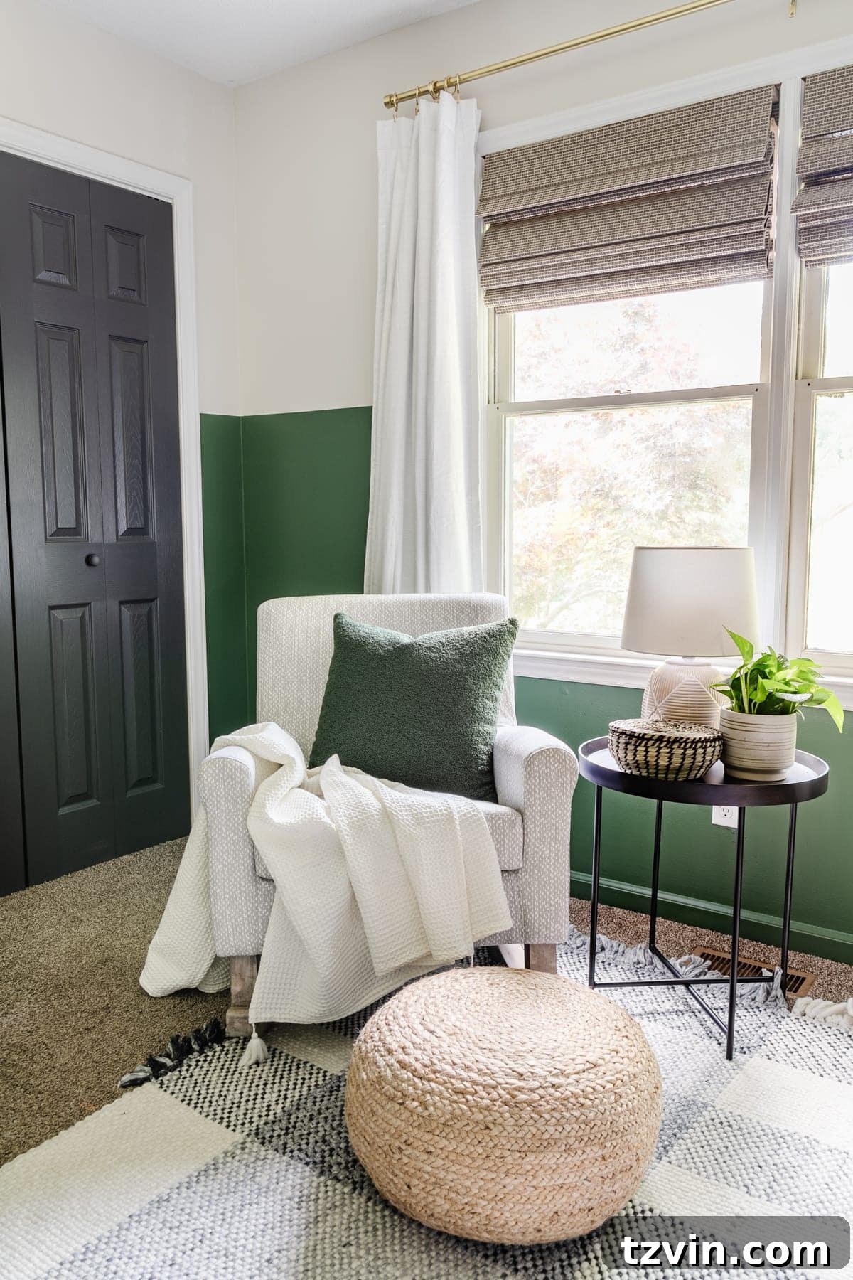 Our Cozy Woodland Wonderland: Baby Boy Nursery Transformation 10 Nursery rocker with gray pattern, plaid rug, green paint, blackout curtains, black door, and side table